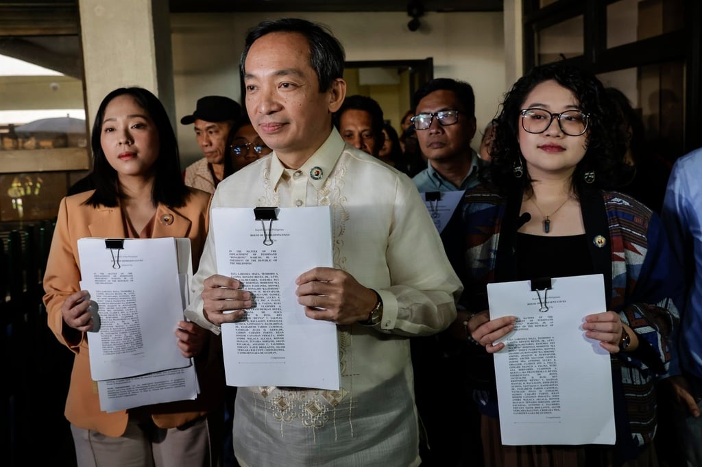 Philippine legislators hold documents of an impeachment complaint against President Ferdinand Marcos Jnr on January 22. Photo: EPA