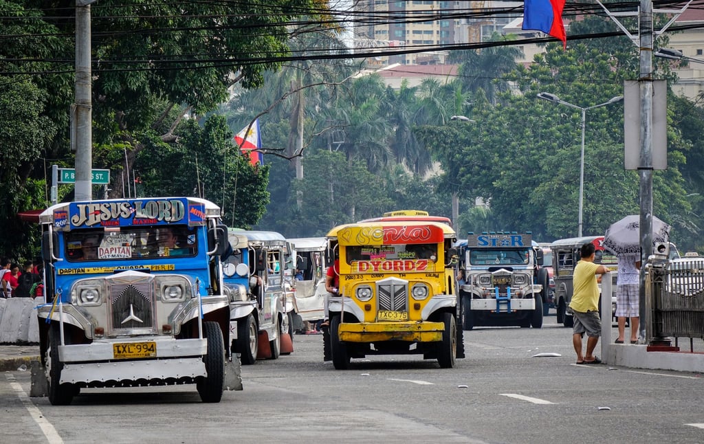 Jeepneys ply the roads in downtown Manila. The Philippines has been trying to encourage local vehicle production through programmes such as CARS and RACE. Photo: Shutterstock