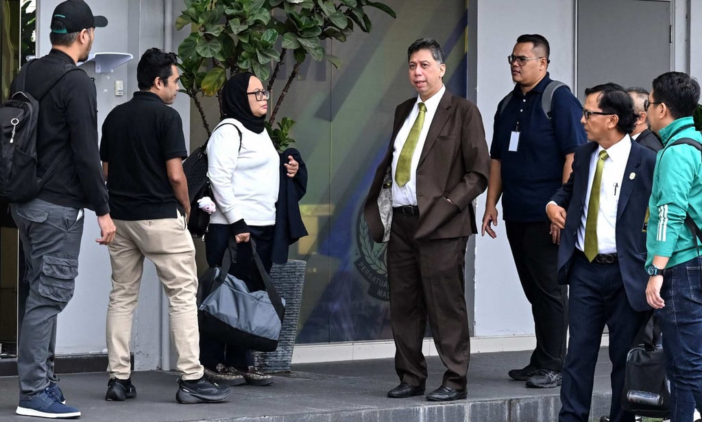 Members of FAM’s executive committee leave its headquarters after resigning on Wednesday. Photo: AFP