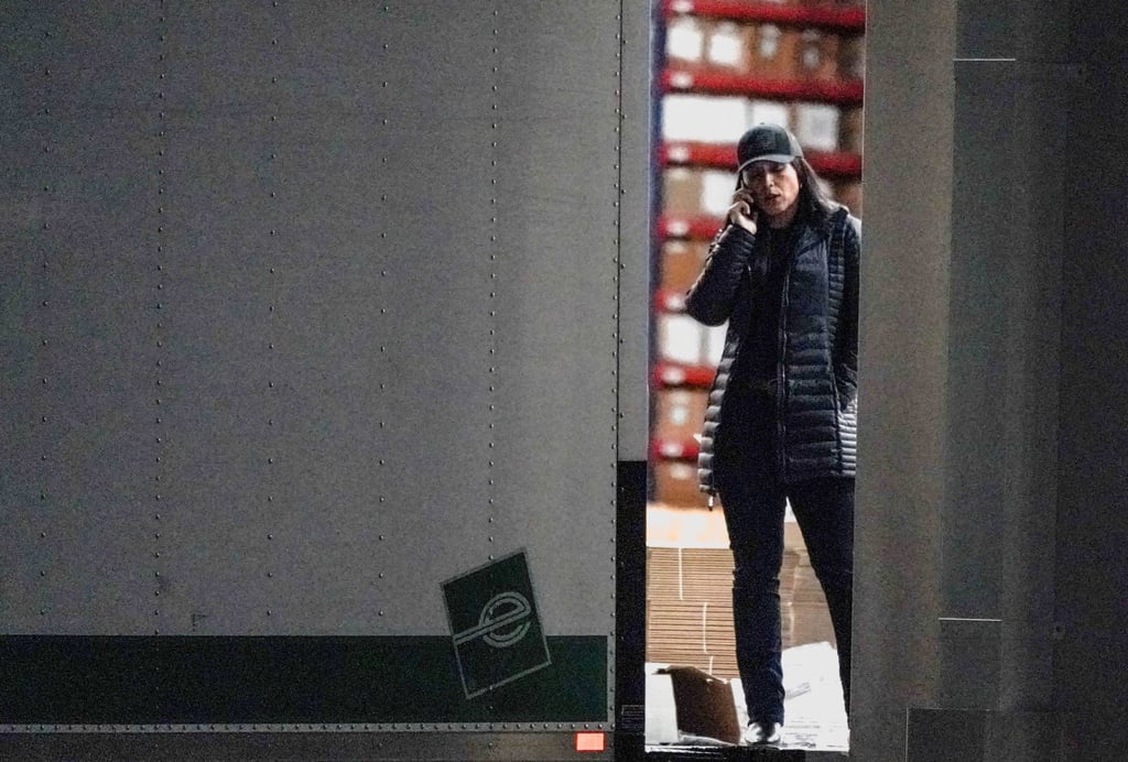 Tulsi Gabbard standing at the edge of a truck loading bay. Photo: Reuters