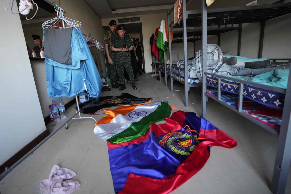 Thai soldiers inspect an abandoned bedroom at the scam centre in O’Smach, Cambodia, on Monday. Photo: AP