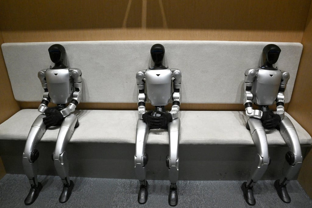 Three humanoid robots sit at Unitree’s first retail store in Beijing on January 9, 2026. Photo: AFP