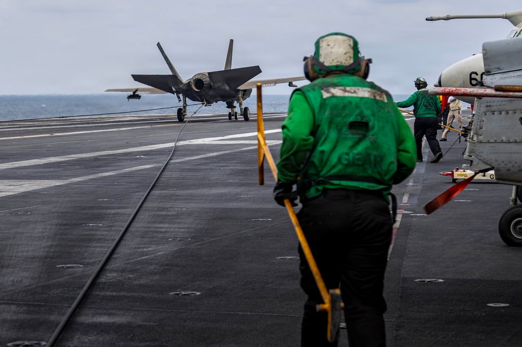 An F-35C Lightning II makes an arrested landing on the flight deck of the Abraham Lincoln in the Arabian Sea on Wednesday. Photo: US Navy via EPA