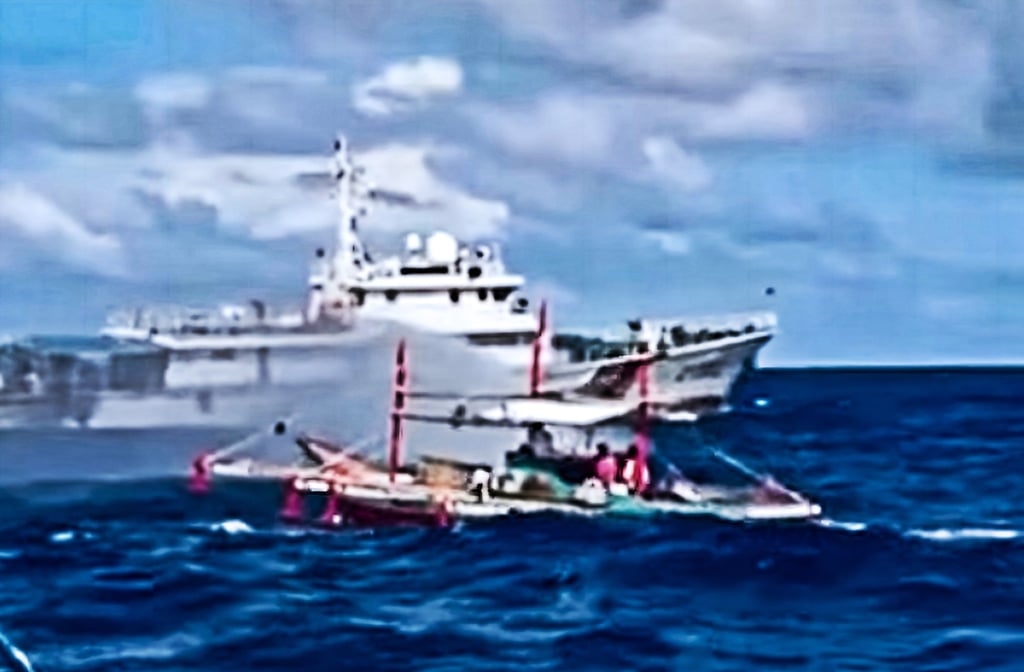 A frame from the video released by the Philippine Coast Guard in December of what it said showed a Chinese vessel deploying water cannon towards a fishing boat near Sabina Shoal in the South China Sea. Photo: Handout
