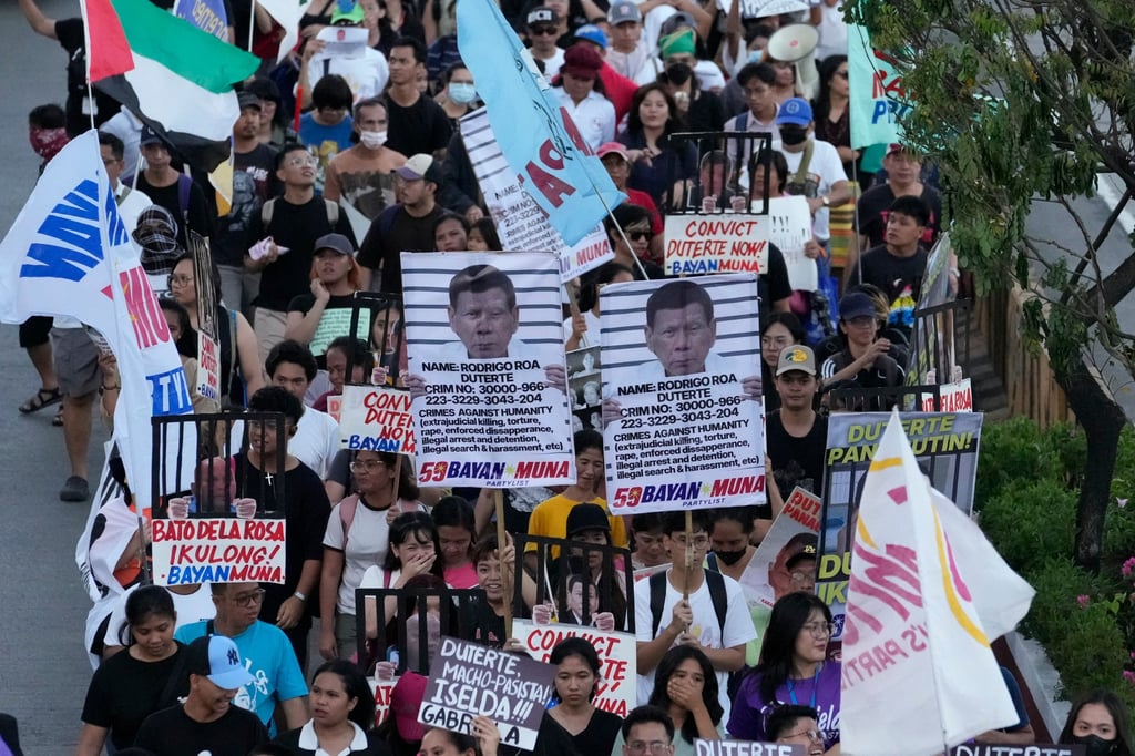 Protesters hold pictures of former president Rodrigo Duterte as they call for justice for the victims of the war on drugs during his administration in Quezon City, the Philippines, in March 2025. Photo: AP