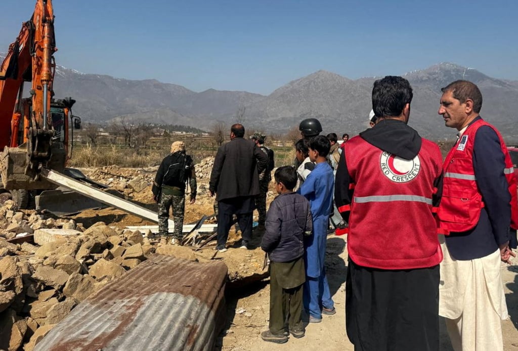 Emergency workers dig through the rubble after a militant attack in Bajaur, Pakistan, on Tuesday. Photo: Pakistan Red Crescent/Reuters