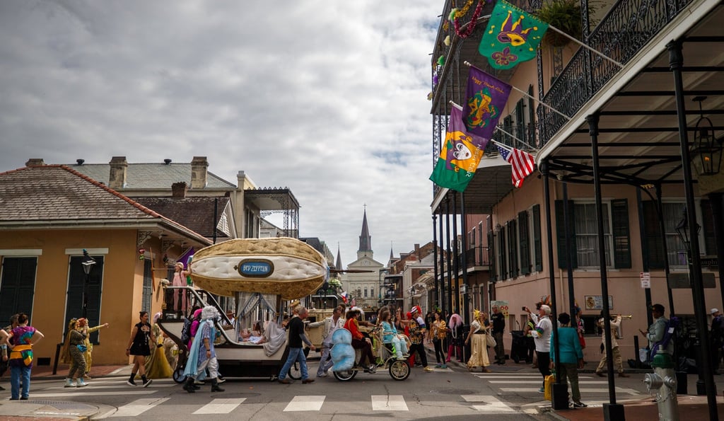 Mardi Gras revellers parade through the New Orleans French Quarter on Tuesday. Photo: AP