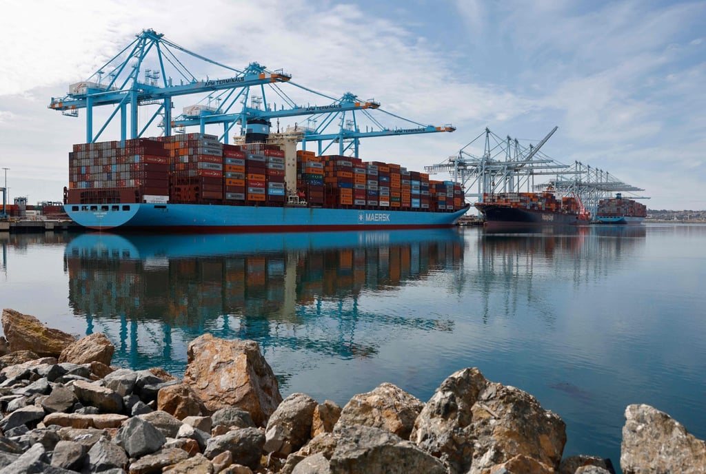 Shipping cranes stand above container ships at the Port of Los Angeles in the US on Friday. Photo: Getty Images/AFP
