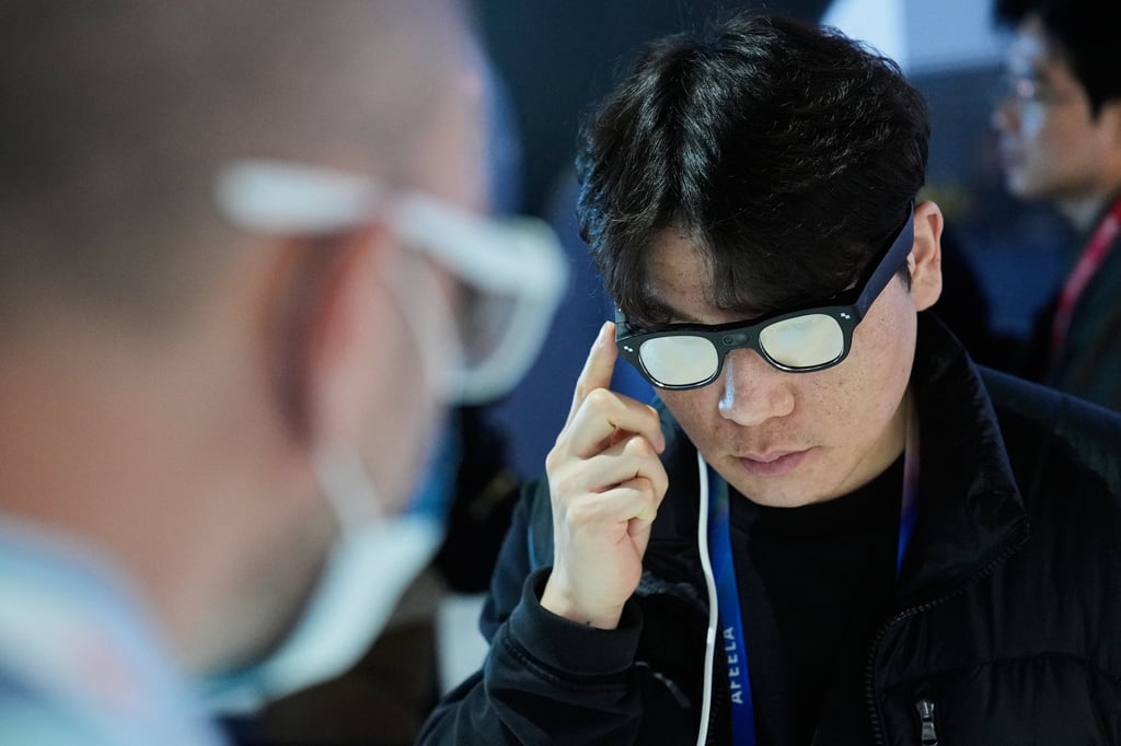 A man interacts with RayNeo’s X3 Pro AI glasses during the CES trade show in Las Vegas on January 7, 2026. Photo: AP