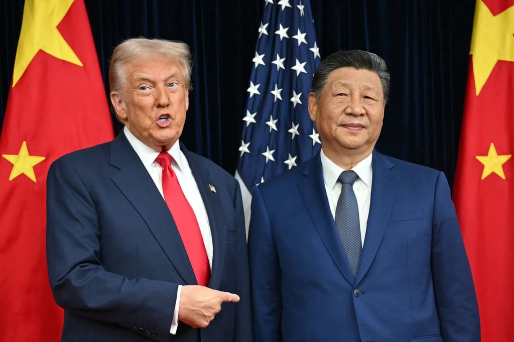 US President Donald Trump and Chinese President Xi Jinping greet each other during their October 2025 summit in Busan, South Korea. Trump will be visiting China from March 31. Photo: AFP