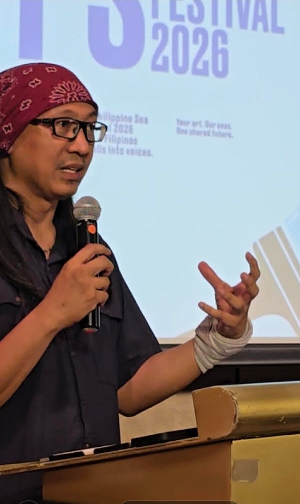 Muralist A.G. Sanno speaks at the launch of the competition. Photo: Raissa Robles
