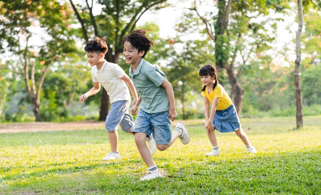 A trio of children having fun in a park. The ancient ritual involved a lot of running. Photo: Shutterstock