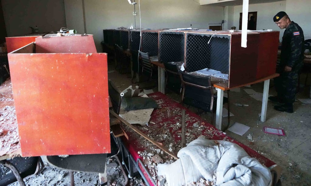 A Thai soldier inspects a workstation inside a scam compound in O’Smach, Cambodia, on February 2, 2026. Photo: AP