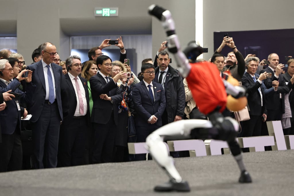 Friedrich Merz attends a performance of humanoid robots at the Unitree Robotics headquarters. Photo: Reuters