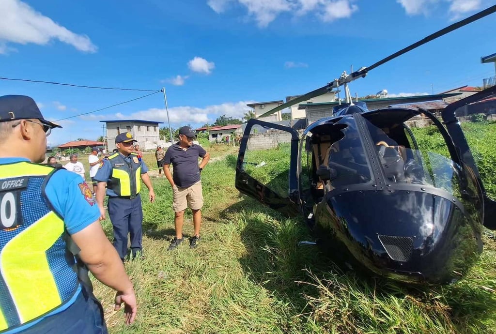 The wreckage of a helicopter is seen after it makes a forced landing in a grassy area in Pililla town. Photo: Rizal Provincial Police Office