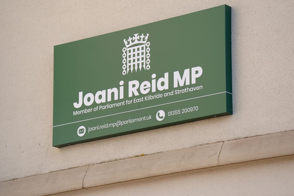 Signage is seen at the constituency office of Joani Reid in East Kilbride, Scotland, on Wednesday. Photo: PA via AP