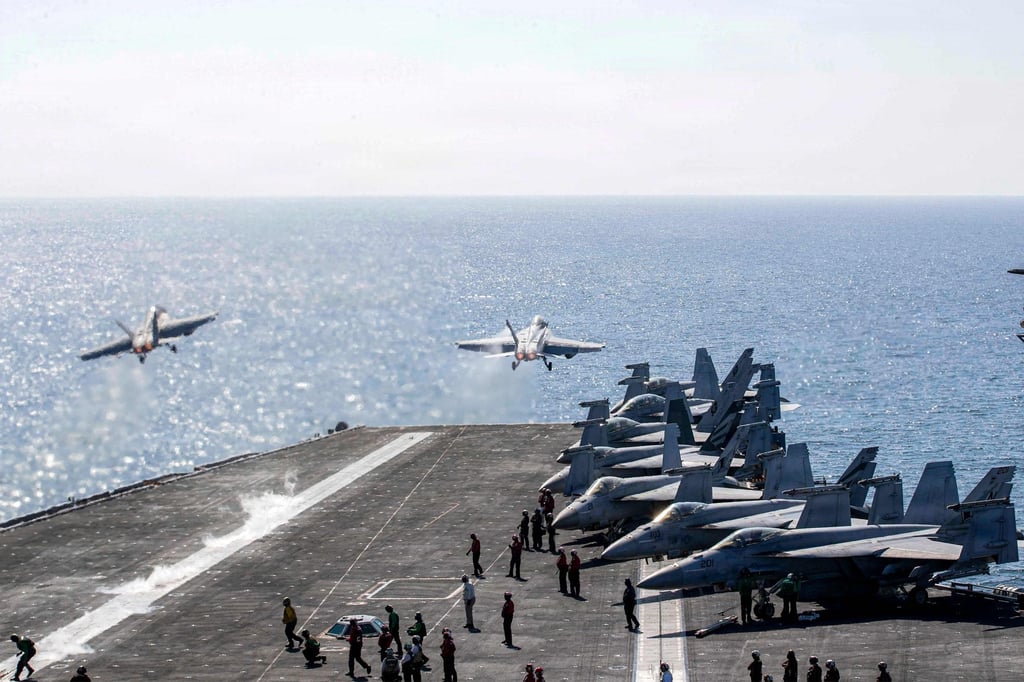 Two F/A-18 Super Hornets launch from the USS Abraham Lincoln. Photo: US Navy via AFP