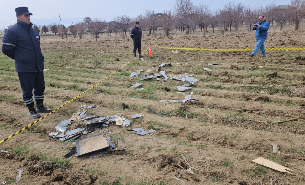Azeri security personnel guard the debris of what is believed to be an Iranian drone near a school in Nakhchivan Autonomous Republic on Thursday. Photo: Azerbaijan State News Agency/Xinhua
