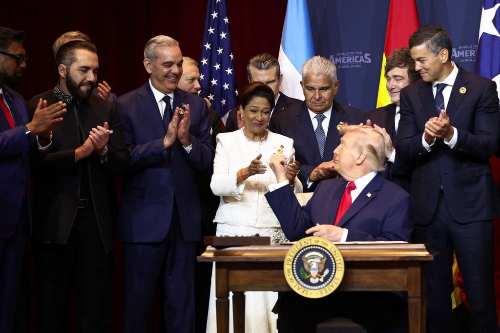 US President Donald Trump reacts after signing the “Commitment to countering cartel criminal activity” document during the “Shield of the Americas” summit with Latin American leaders in Miami, Florida, on Saturday. Photo: Reuters