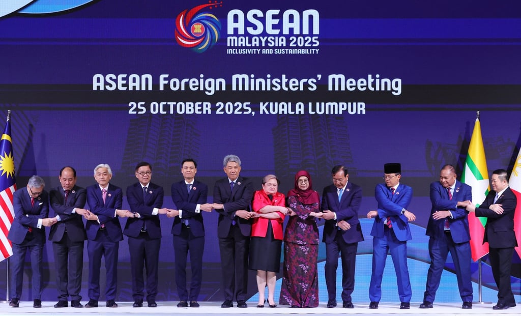 Asean foreign ministers join hands for a photo during a summit in Kuala Lumpur on October 25, 2025. Photo: EPA