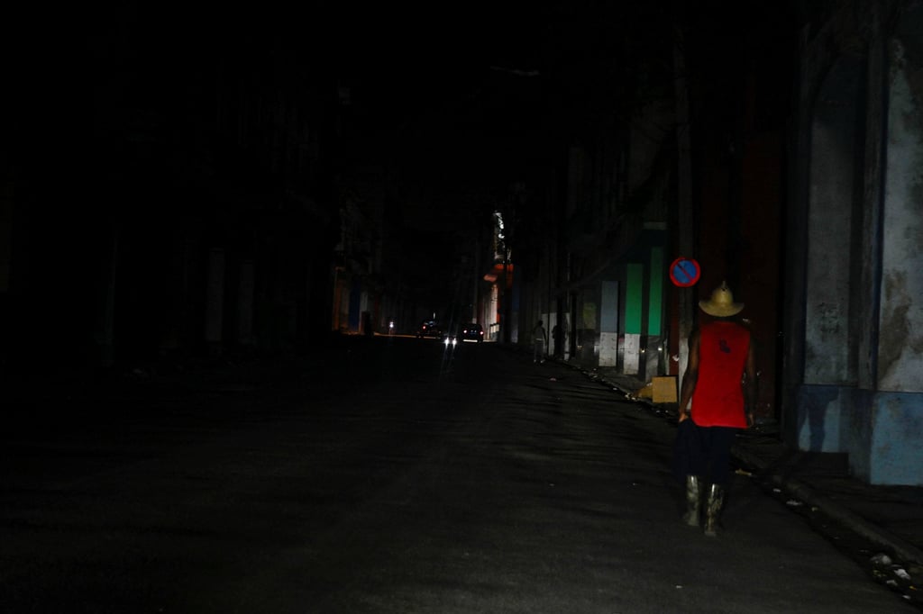 A man walks along a street during a blackout in Havana, Cuba, on Friday. Photo: Reuters