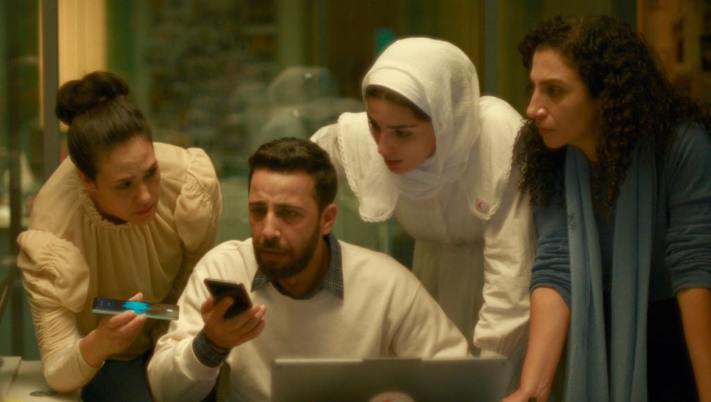 Motaz Malhees (second left) is seen in a scene from “The Voice of Hind Rajab”. Photo: CineCanabal/AP