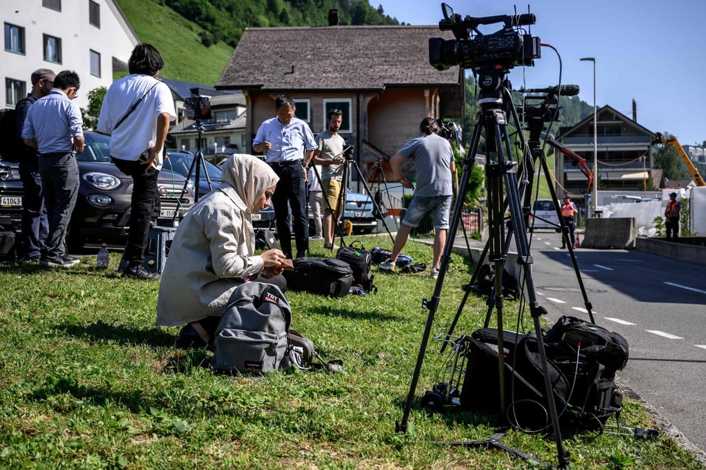 Journalists set up near an access to the Burgenstock luxury hotel complex above Lake Lucerne on Friday, where talks following up on a deal to end the Middle East conflict were scheduled to begin. Photo: AFP