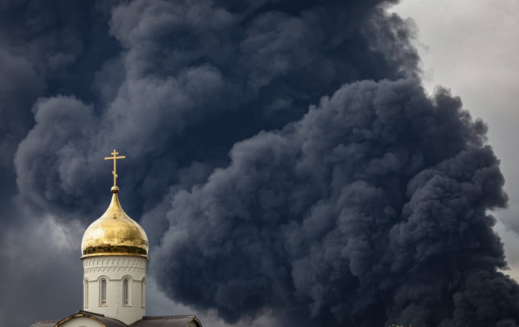 Smoke billows behind an Orthodox church following a reported Ukrainian drone attack in Moscow on Thursday. Photo: EPA
