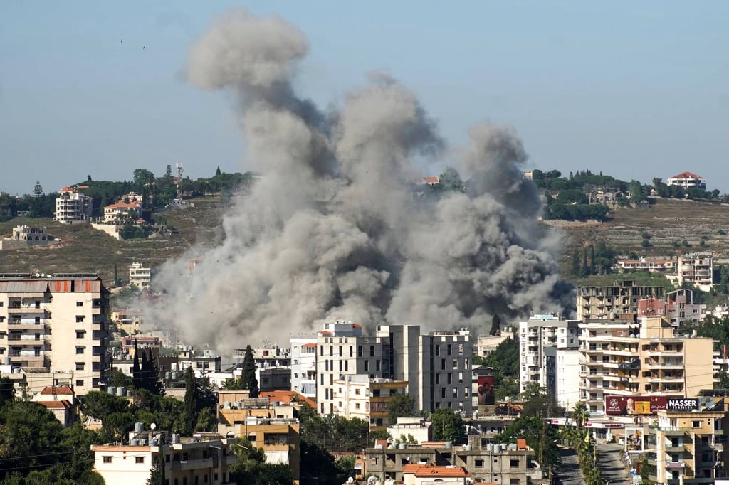 Smoke rises from the site of a string of Israeli air strikes that targeted the southern Lebanese city of Nabatieh on Saturday, despite a new ceasefire between Israel and the Iran-backed Hezbollah group announced a day earlier. Photo: AFP