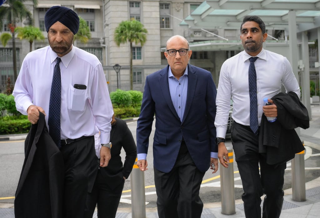 Singapore’s former Transport Minister S. Iswaran (centre) arrives at the State Courts with his legal team on January 18, 2024. Photo: The Straits Times/EPA-EFE