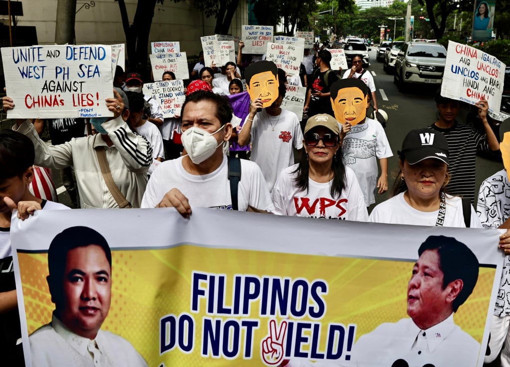 Filipino protesters hold placards during a protest in front of the Chinese embassy in Manila in August last year. Photo: EPA
