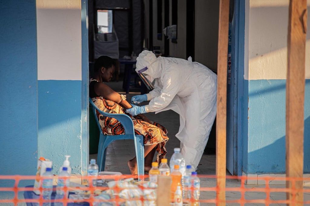 A healthcare worker takes samples from a patient suffering from Ebola in the Democratic Republic of Congo on Tuesday. Photo: AFP