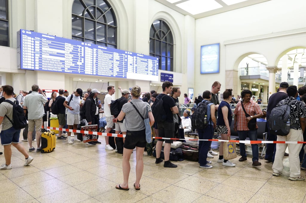 Passengers gather at Hanover railway station after train services were disrupted nationwide in Germany on Tuesday. Photo: dpa