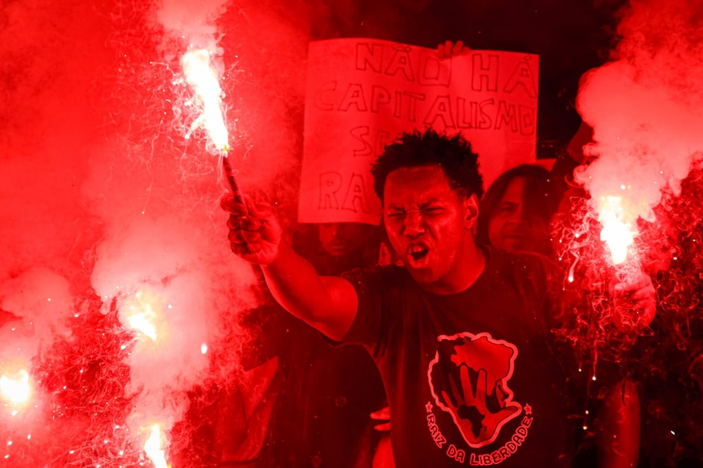 People protest outside the Spanish consulate in Sao Paulo, Brazil, in May 2023 against racism suffered by Brazilian soccer star Vinicius Junior. Photo: AP