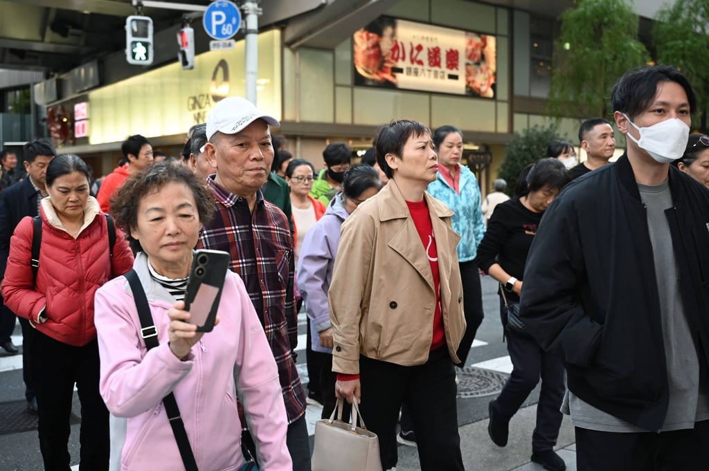 Members of a Chinese tour group seen in the Ginza shopping district in Tokyo on November 17, 2025. Photo: AFP