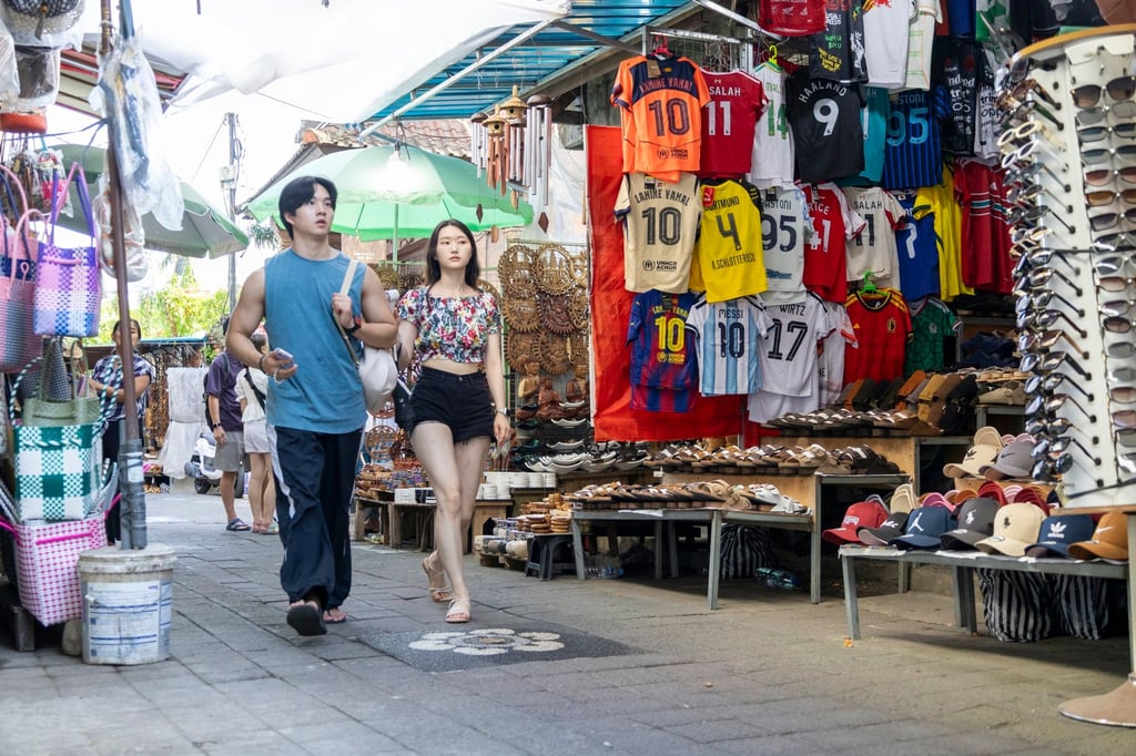 Tourists walk through a shopping area in Ubud, Bali, on June 2. Indonesia’s tourism ministry is looking to expand visa-free access to more countries. Photo: EPA