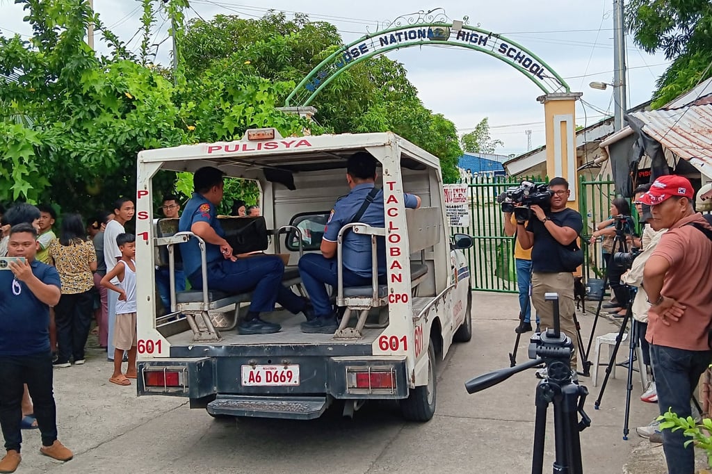 A police vehicle enters San Jose National High School a day after a shooting incident on Monday inside the school in Tacloban, Leyte, Philippines. Photo: AP