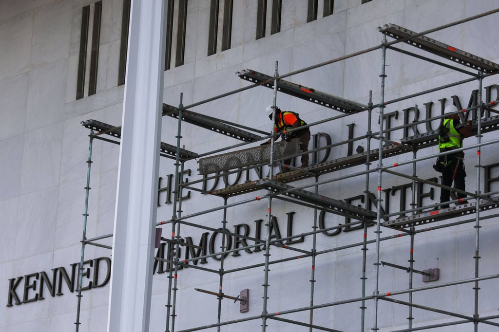 Workers construct scaffolding in preparation for the removal of US President Donald Trump’s name from facade of the Kennedy Centre in Washington on June 12. Photo: dpa
