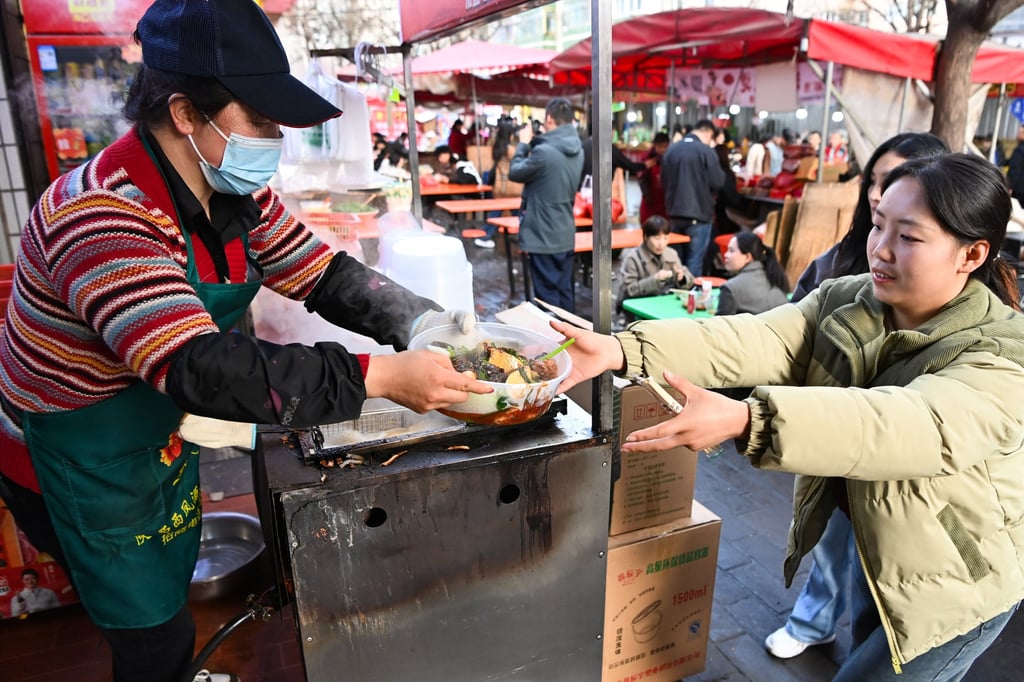 A vendor prepares malatang, a mix of ingredients boiled in a hot, spicy broth, for customers at a diner in Tianshui, Gansu province. Such meals are staples in many parts of China. Photo: Getty Images