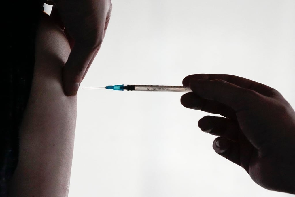 A doctor injects a Covid-19 vaccination in Berlin in 2022. A 40-year-old palliative care doctor in Germany is charged with killing 15 patients in total – 12 women and three men – between September 2021 and July 2024. Photo: AP