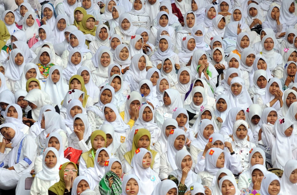 Young women attend a ceremony marking the 85th anniversary of the Nahdlatul Ulama organisation in Jakarta in 2011. Photo: AFP