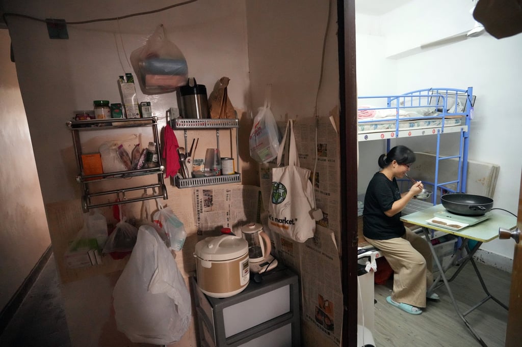 A mother eats in a subdivided flat in Sham Shui Po, on October 15, 2024. Photo: May Tse