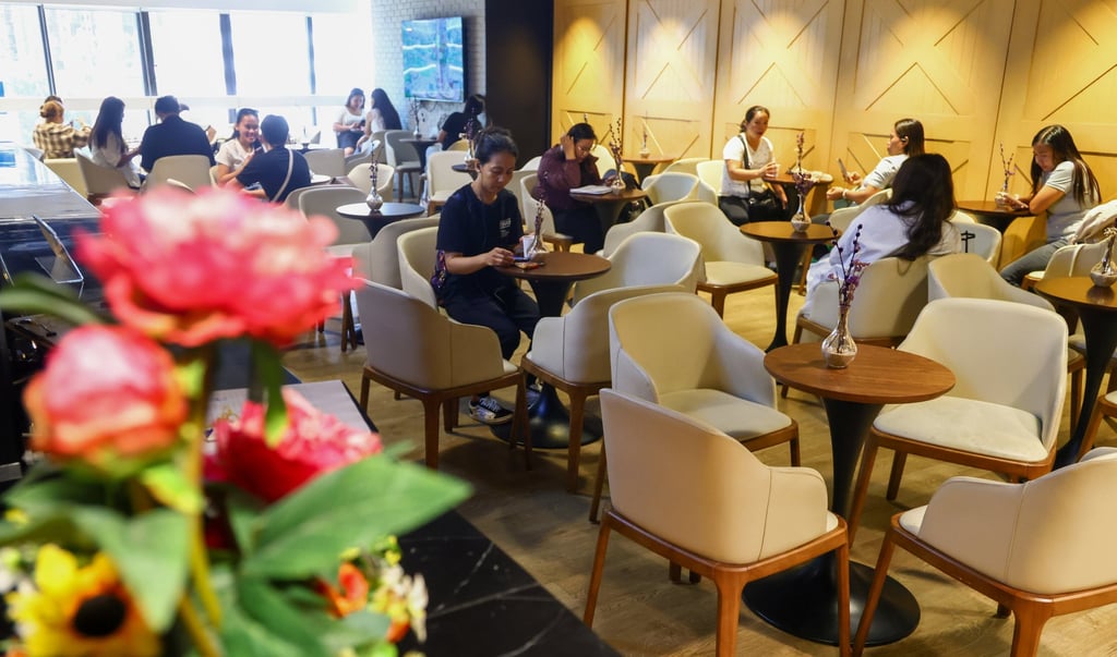 Overseas Filipino workers relax at the Philippine Consulate’s newly opened OFW Centre at United Centre in Hong Kong on May 27. Photo: Dickson Lee