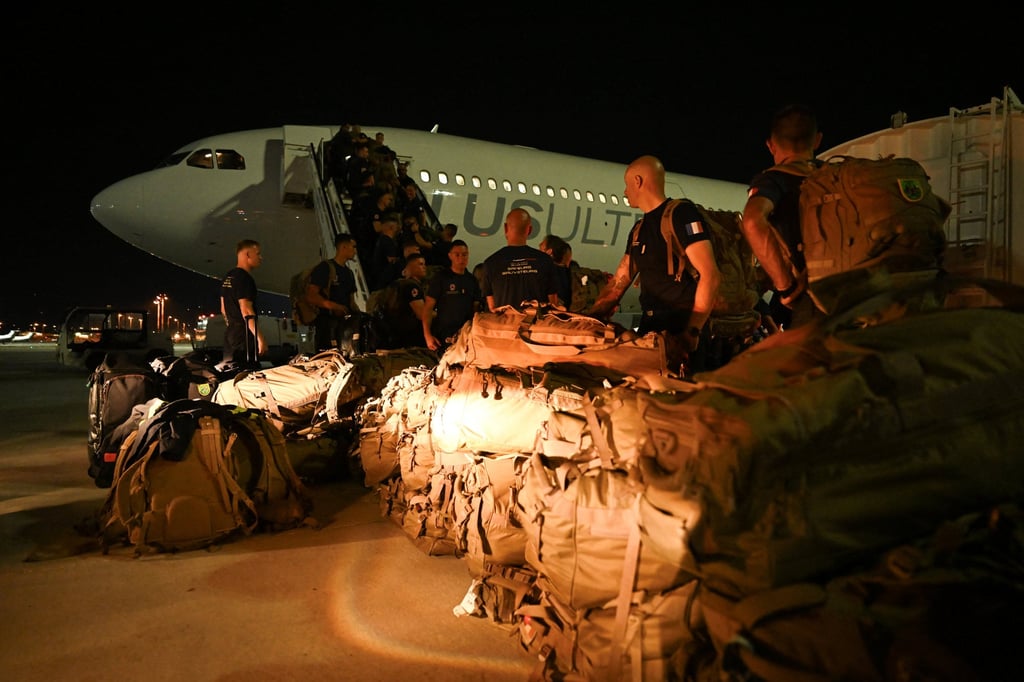 French officers of the 7th Civil Security Training and Response Regiment prepare their baggage before flying to Venezuela to provide help after two earthquakes hit the country, at the Marseille Provence Airport in Marignane, southern France, on Saturday. Photo: Reuters