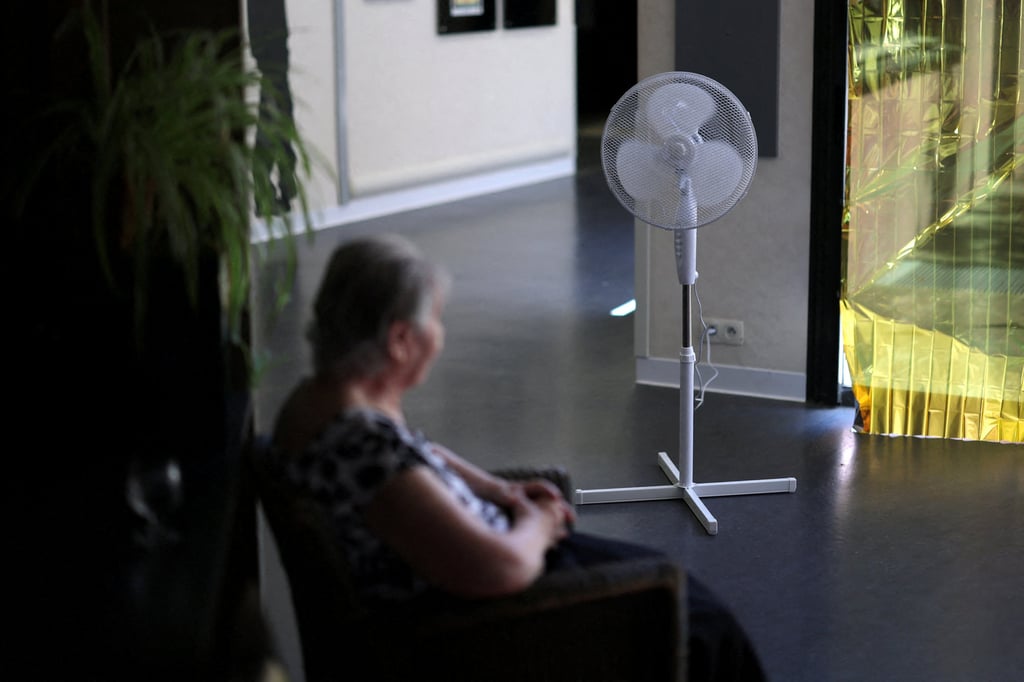 A fan is set up as an elderly resident sits in a retirement home in Les Sorinieres near Nantes, France on Monday. Photo: Reuters