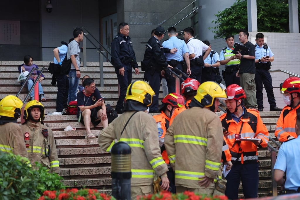 Some of those injured waited on the steps for help. Photo: Edmond So