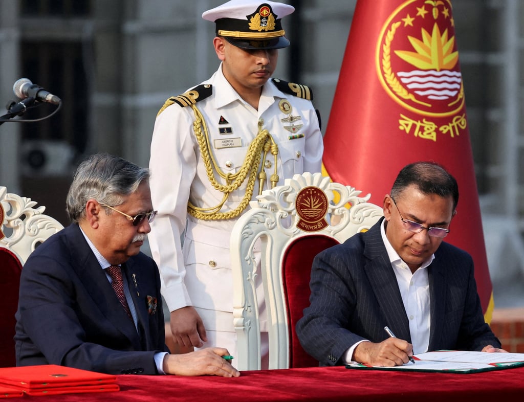 Tarique Rahman signs in as Bangladesh’s new prime minister during an oath‑taking ceremony administered by President Mohammed Shahabuddin in Dhaka on February 17. Photo: Reuters