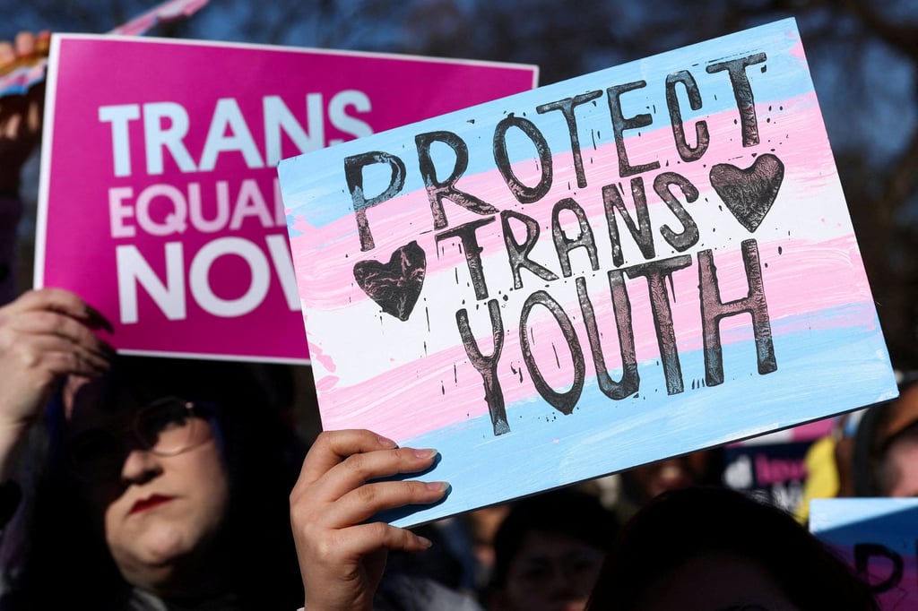 Transgender rights supporters hold placards outside the US Supreme Court in Washington DC in January. Photo: Reuters