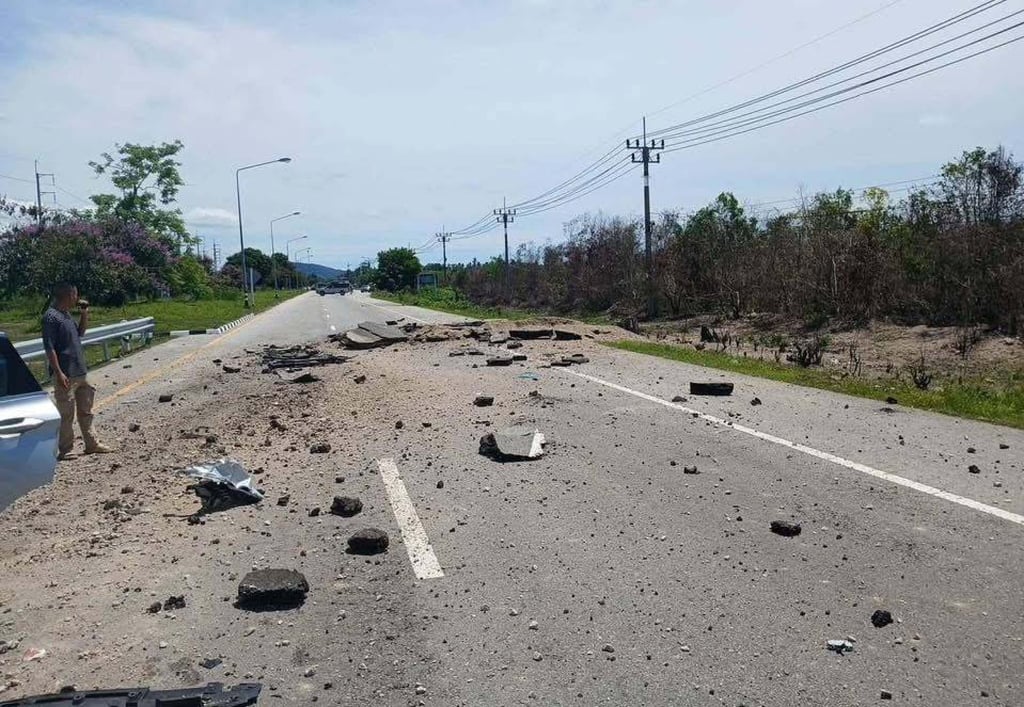 Debris is scattered on the road after a roadside bomb goes off in Thailand on Monday. Photo: Handout