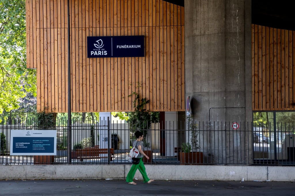 A pedestrian walks outside the Funerarium of Paris in France on Sunday. Photo: EPA